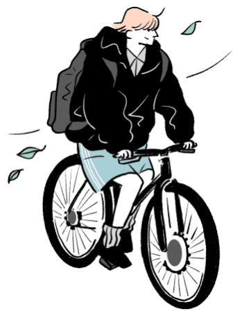 自転車を漕ぎながら景色を楽しむ男性